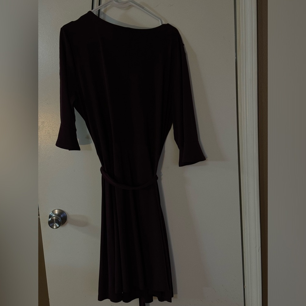 Purple wrap dress with ruffles.